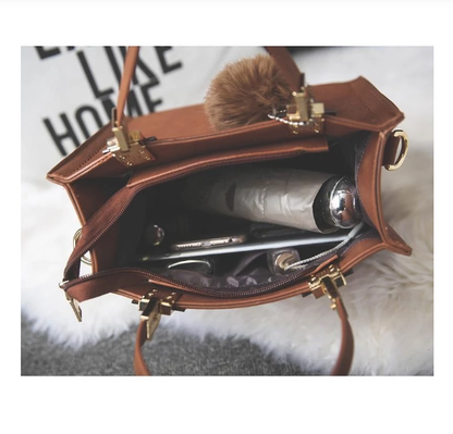 ANNA'S LAETHER HANDBAG WITH FUR BALL