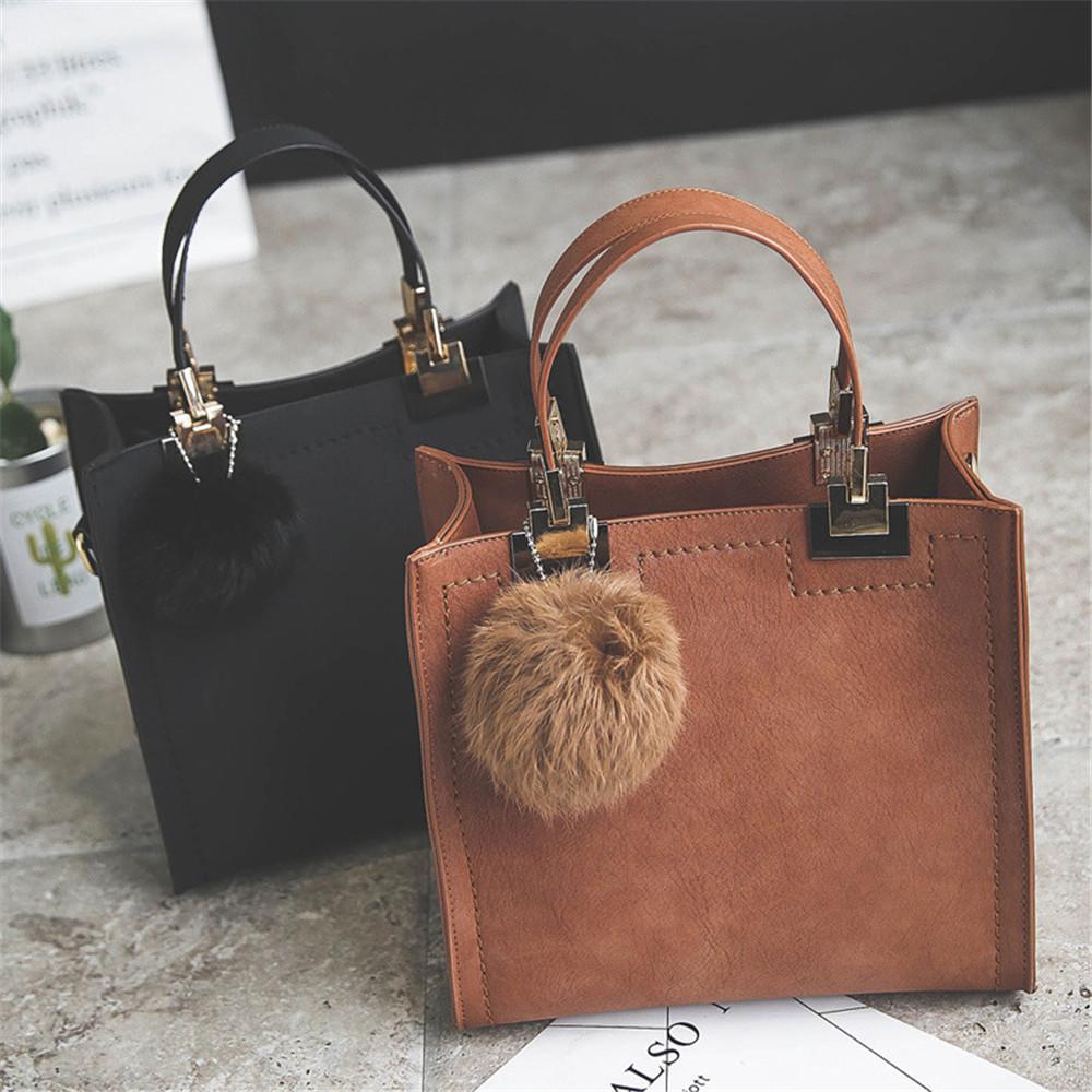 ANNA'S LAETHER HANDBAG WITH FUR BALL