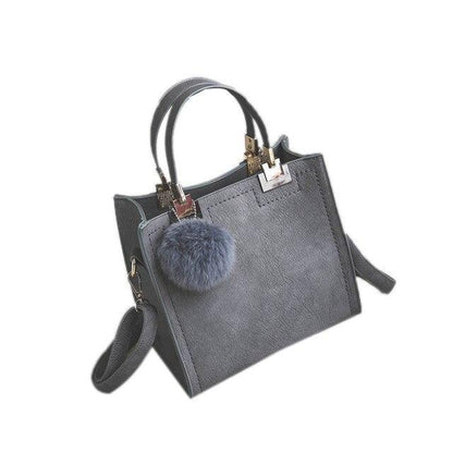 ANNA'S LAETHER HANDBAG WITH FUR BALL